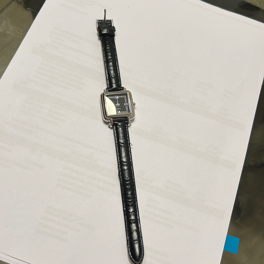 Analogue quartz wristwatch on a metal bracelet, photographed for a marketplace product listing